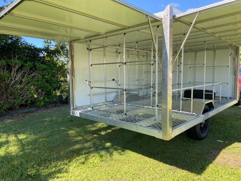 Aluminium trailer with doors open showing ample vertical and horizontal storage space and lattice floor